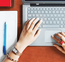 Student focused on studying with computer in library