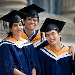 Group of university graduates celebrating outdoors.
