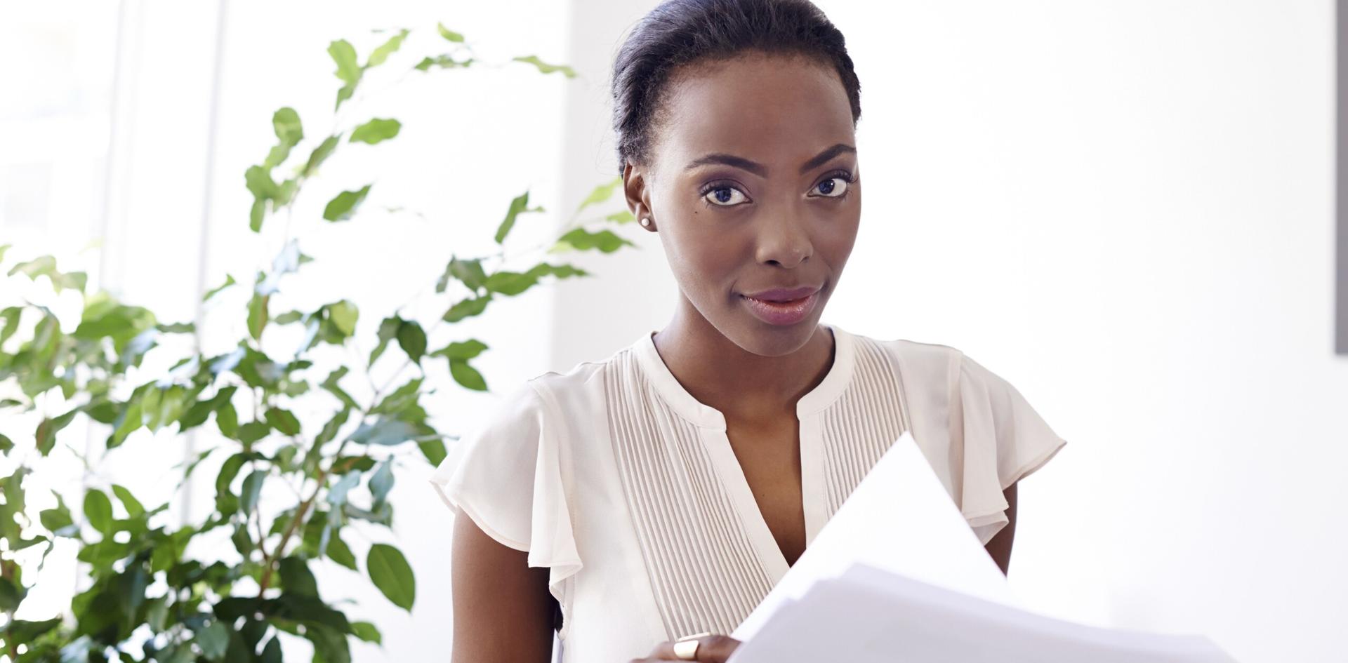 Administrator reviewing documents – business admin career imagery