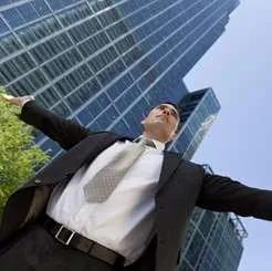 Joyful woman with arms outstretched – career or lifestyle empowerment